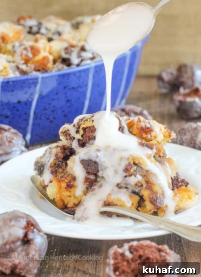 This Coffee Donut Bread Pudding takes everything you love about breakfast and bakes it into one easy dish! Cake donuts baked in a coffee custard for the perfect addition to brunch! A close-up shot of a serving of coffee donut bread pudding, highlighting the glaze and sugar crystals.