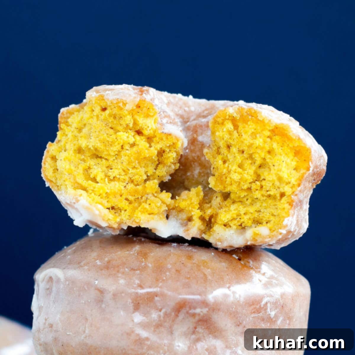 pumpkin donut interior against blue background. 