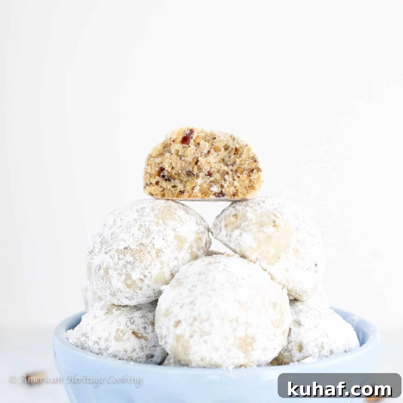 Fiesta Pecan Bites 4 Mexican wedding cookies showing crumbly inside.