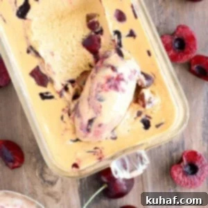 Bourbon Caramel Cherry Ice Cream being scooped with spoon