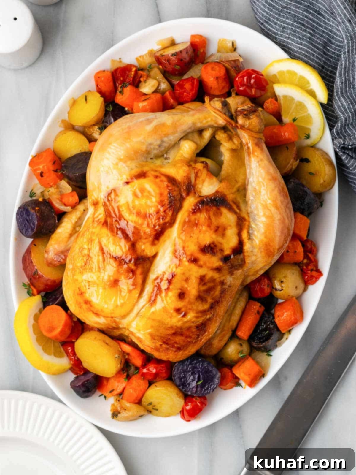 cooked chicken with vegetables on serving platter.