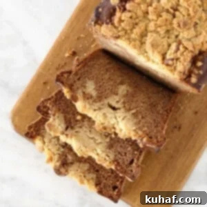 Banana Crumb Bread sliced on wooden board