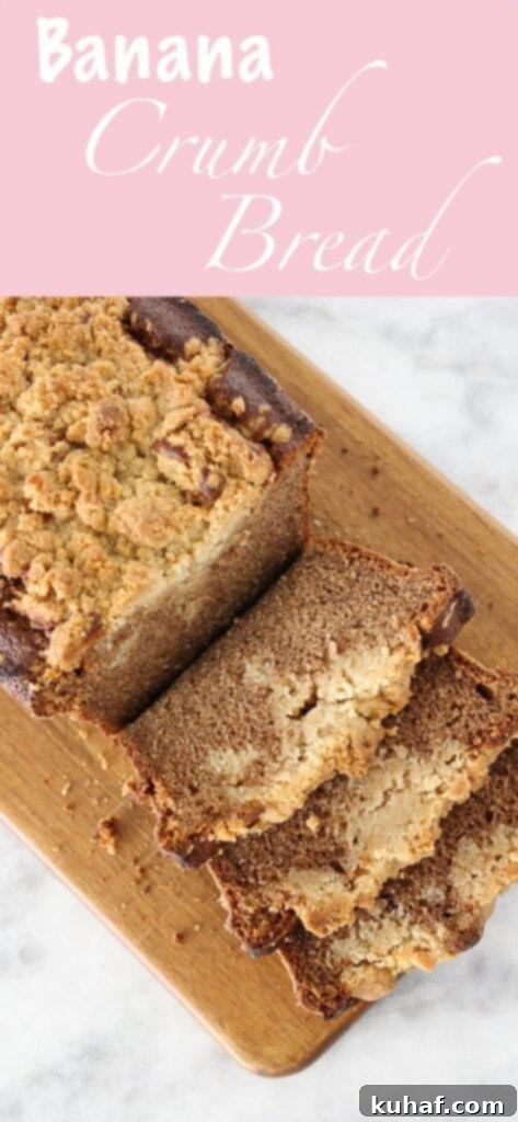 A whole loaf of cinnamon banana crumb bread on a cooling rack, showing the beautiful golden streusel topping.