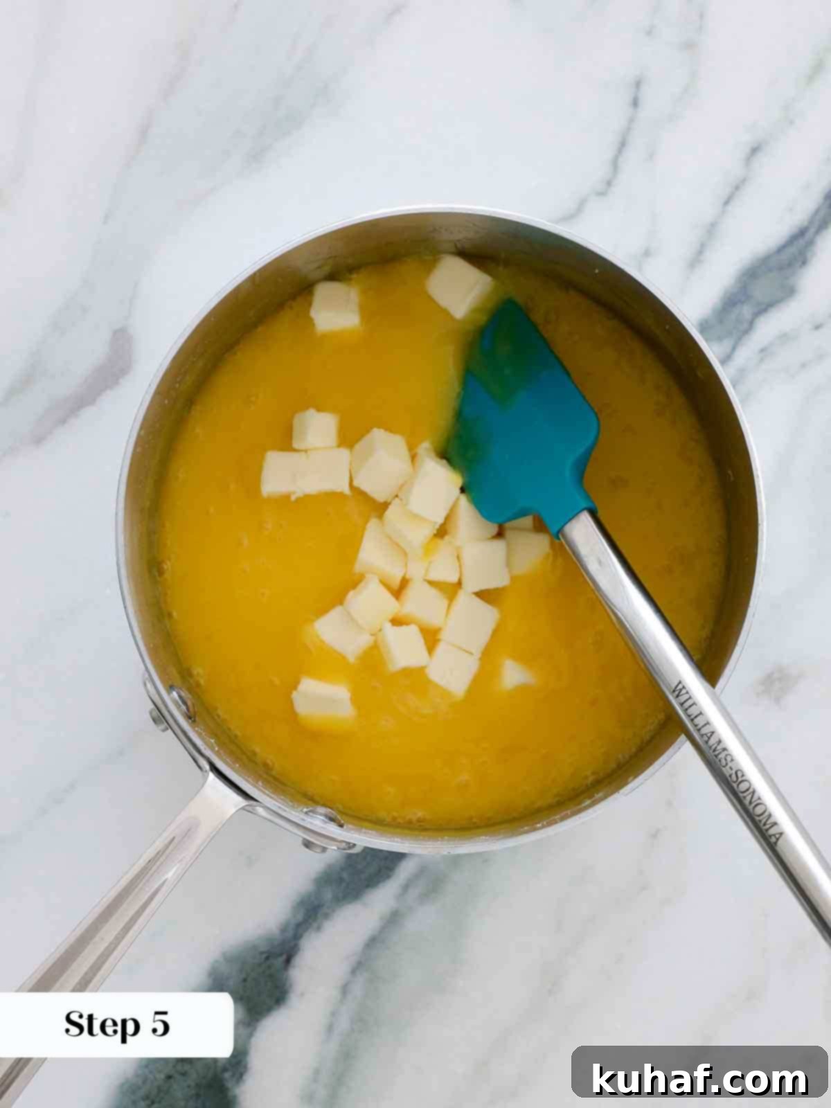 adding butter to lemon curd.