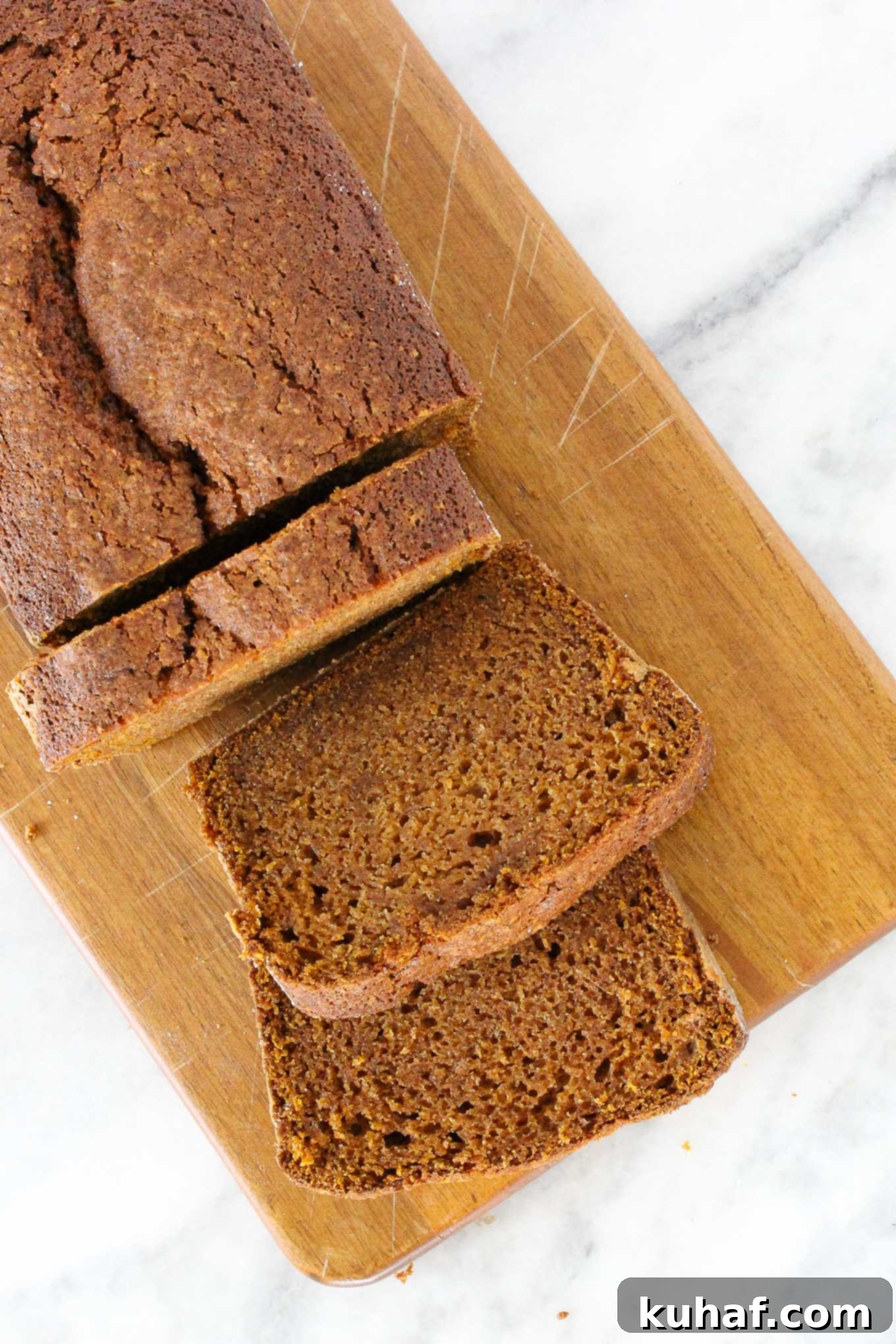 pumpkin bread sliced on wooden board. 