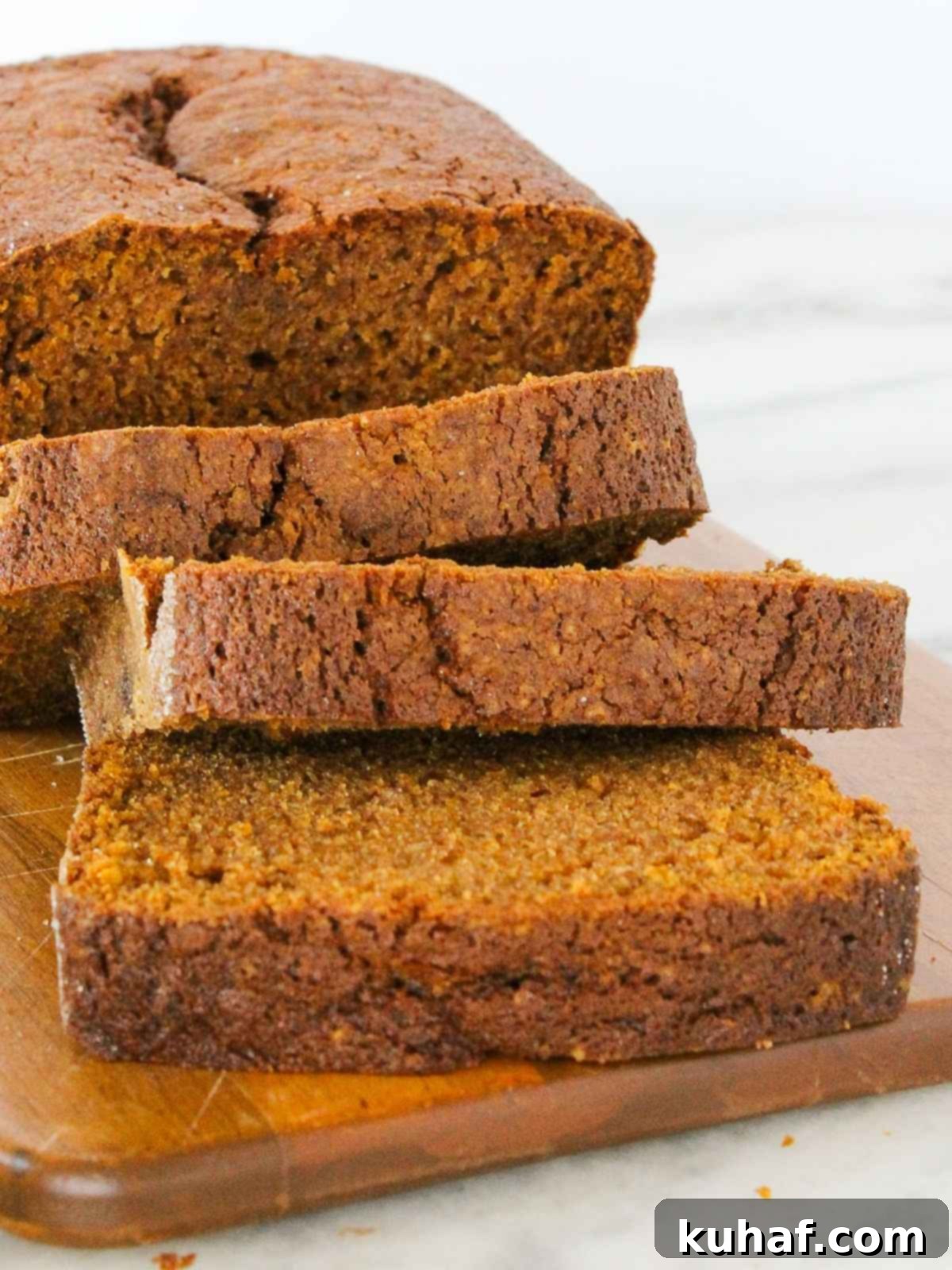 A close-up view of freshly sliced pumpkin bread, showing the moist texture.