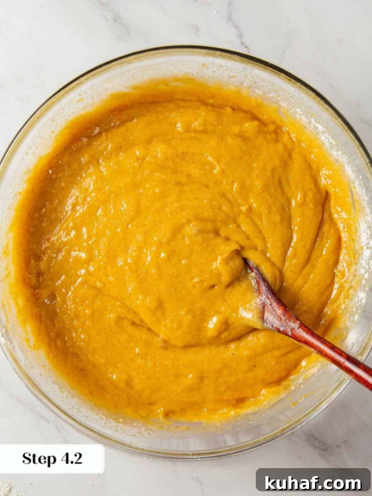 Smooth and creamy pumpkin bread batter ready for baking.