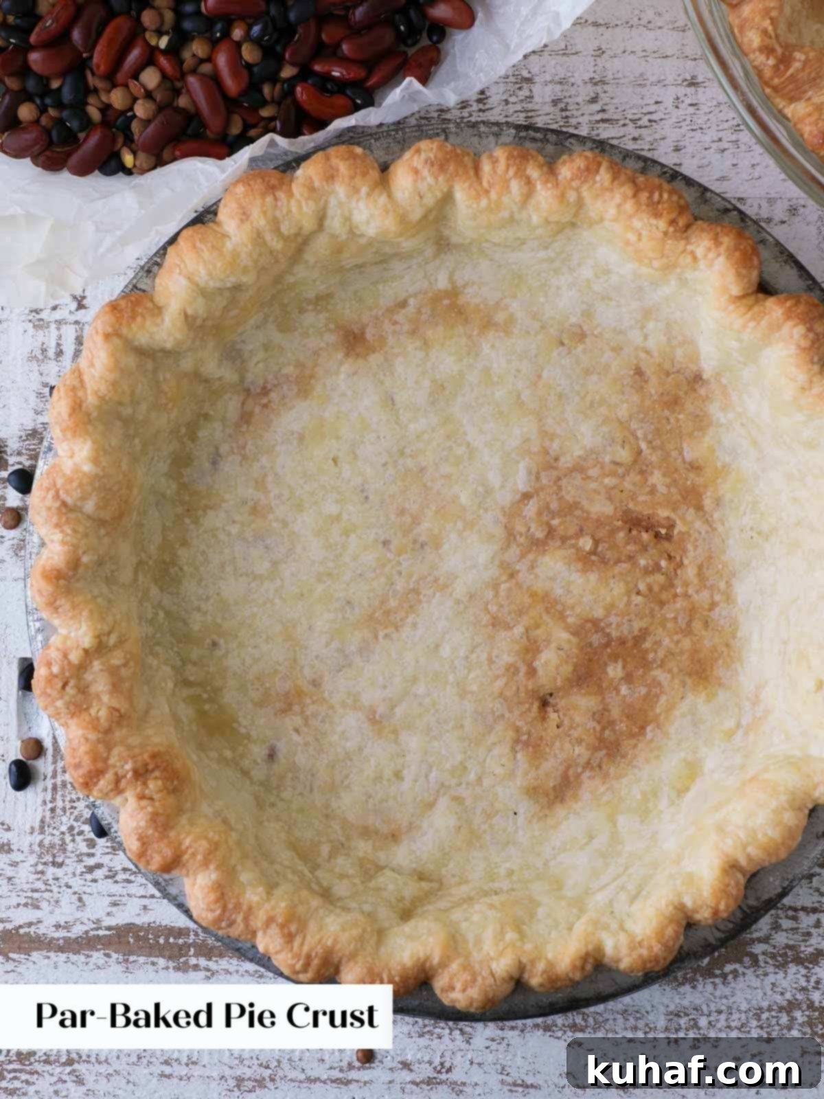 partially blind baked pie crust in tin.