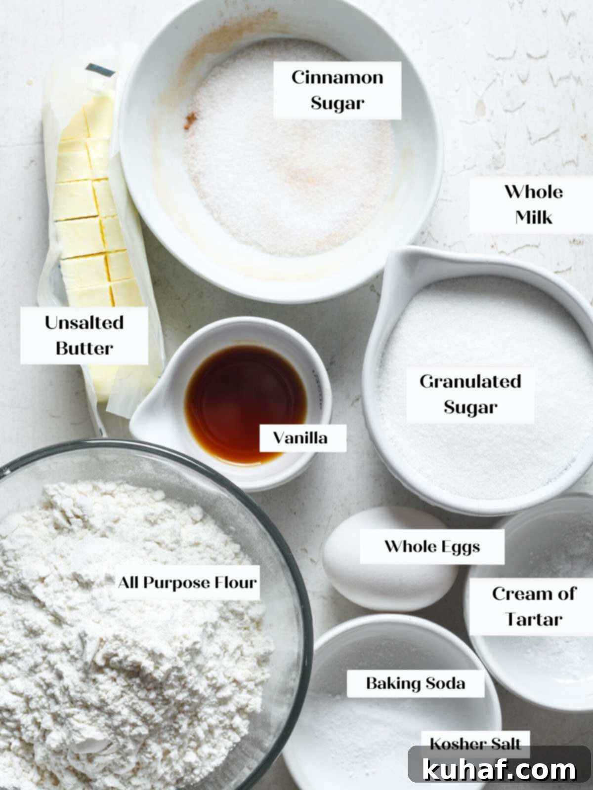 Ultimate Snickerdoodle Cookies 4 Best snickerdoodle cookie ingredients laid out on a marble surface.