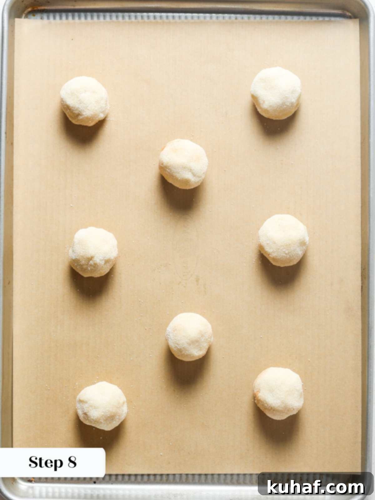 Ultimate Snickerdoodle Cookies 10 Snickerdoodles arranged on parchment paper, ready for baking.