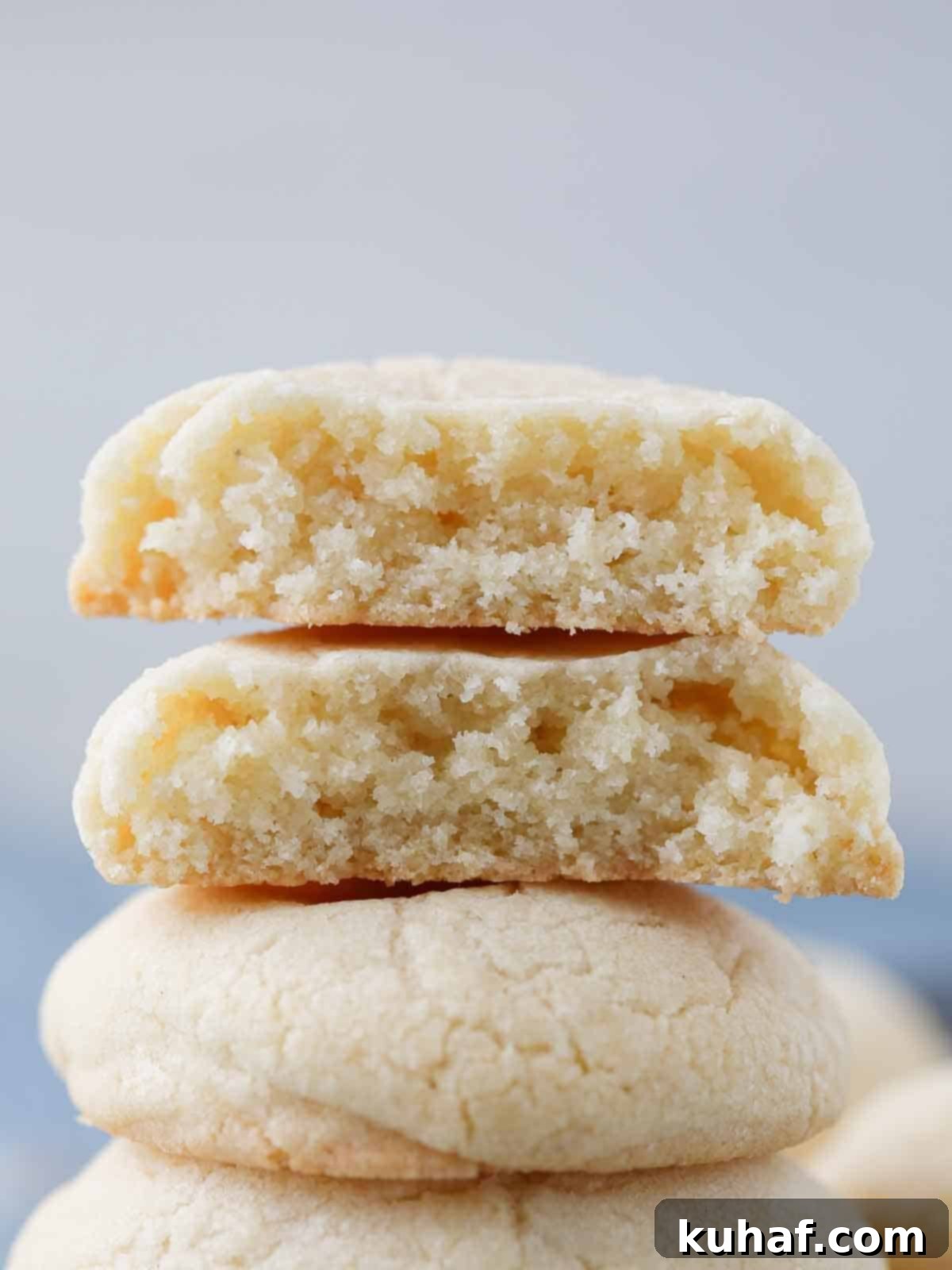 chewy sugar cookies stacked high and broken open. 