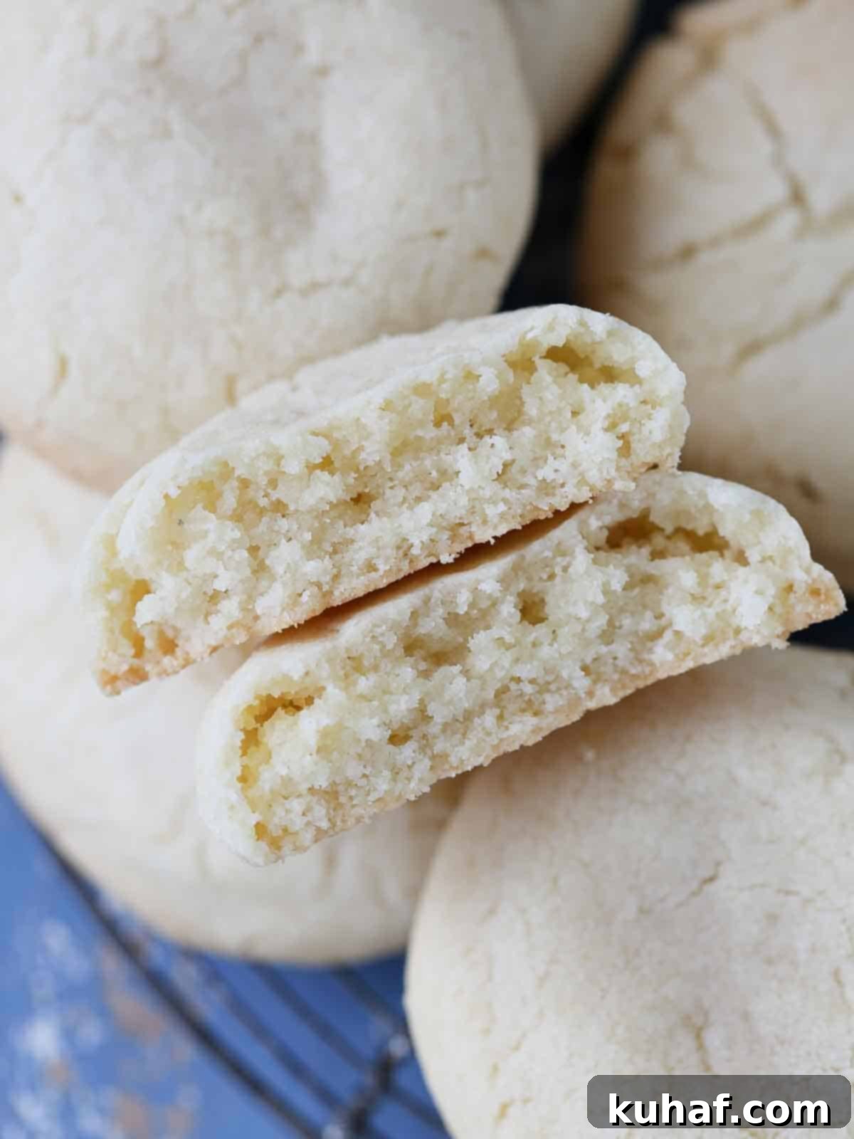 chewy sugar cookie broken open on stack.