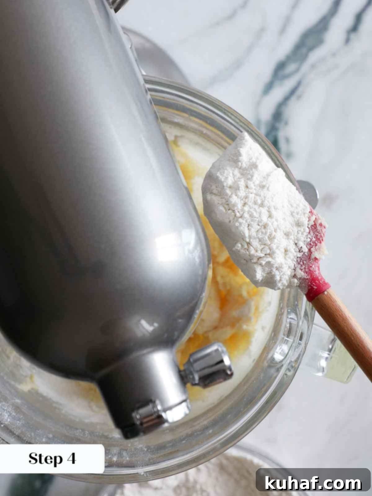 adding dry ingredients to sugar cookies.
