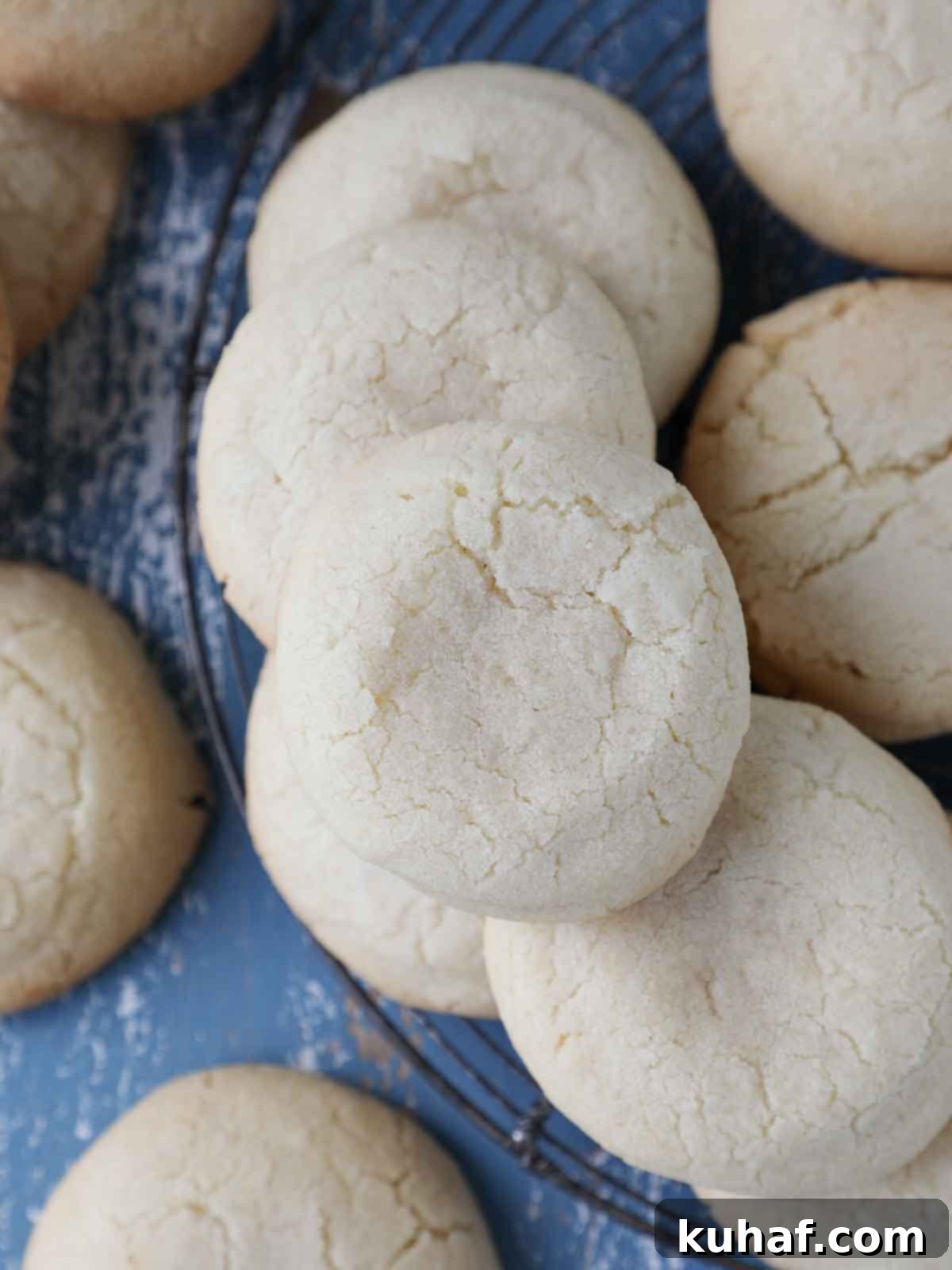 whole sugar cookies cooling on vintage rack.