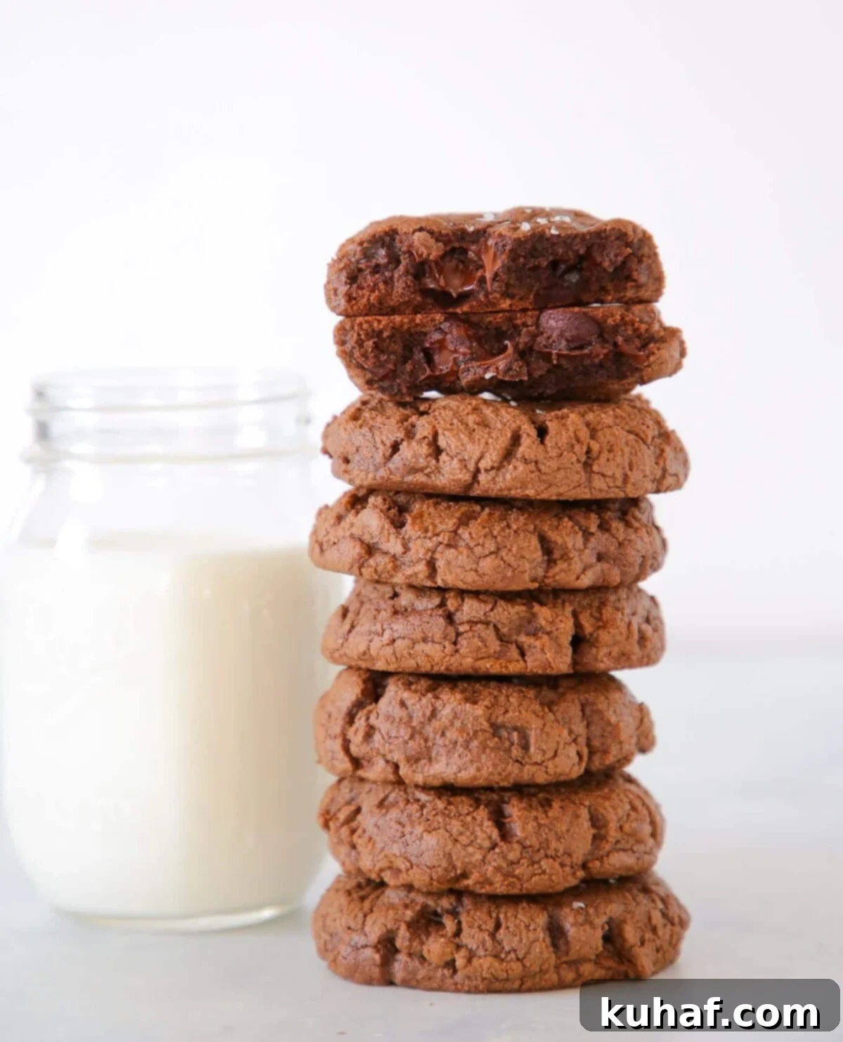 Easy chocolate desserts like these double chocolate chip cookies broken to show gooey chocolate chips.