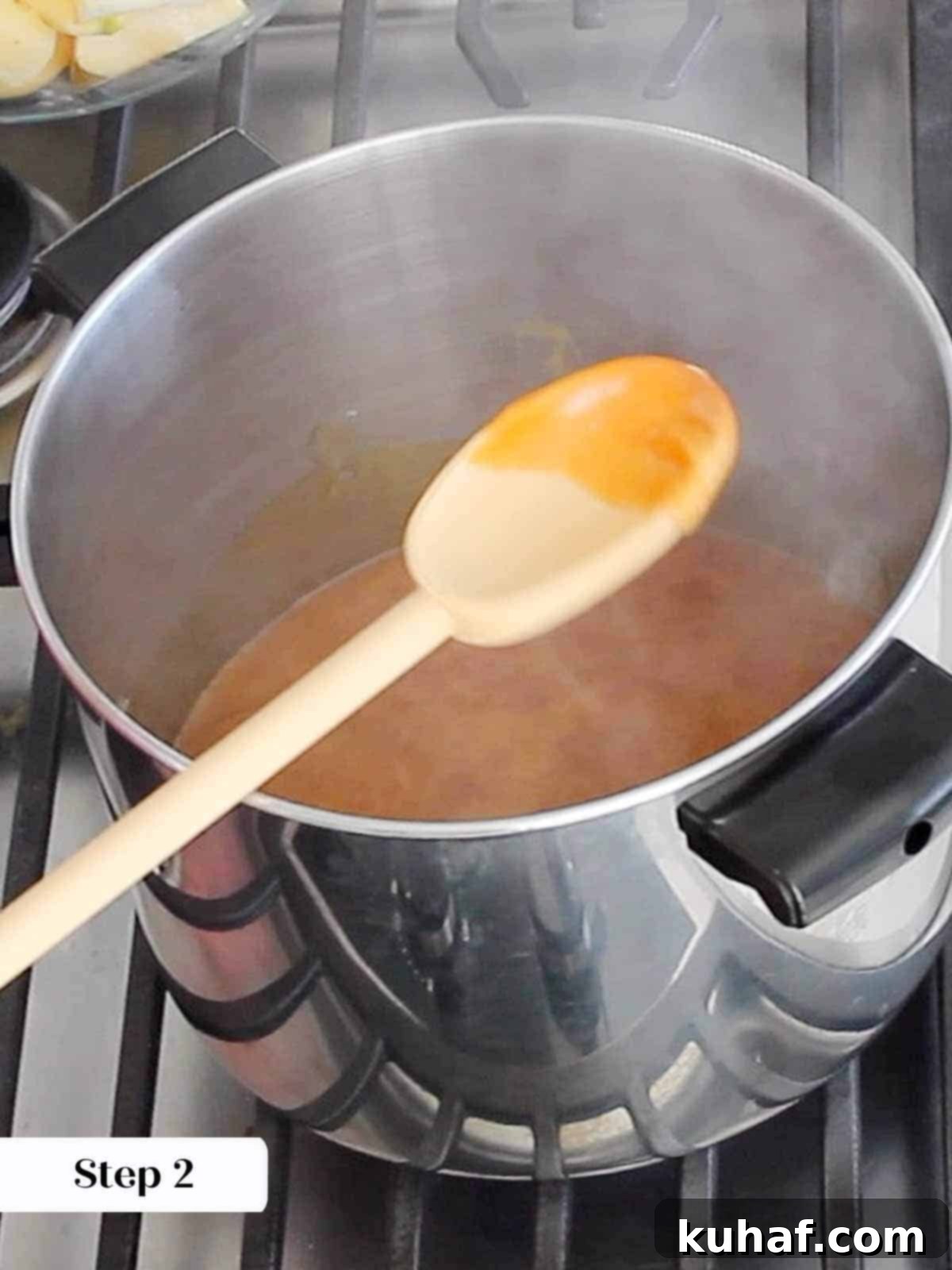 Caramelized Apple Spread 5 Granulated sugar caramelizing in a large pot, the first step to making professional apple butter.