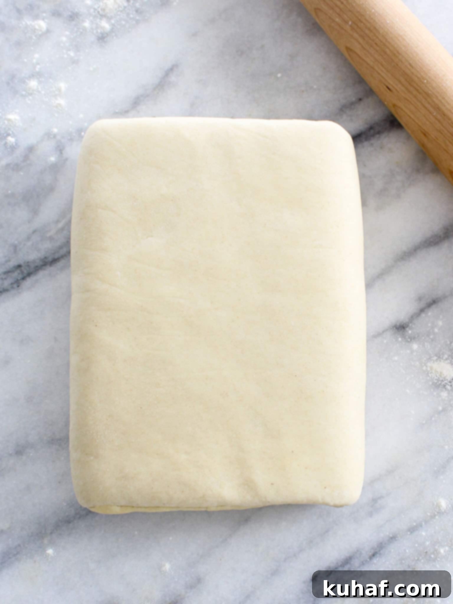 Classic Puff Pastry with wooden rolling pin, perfectly flaky layers