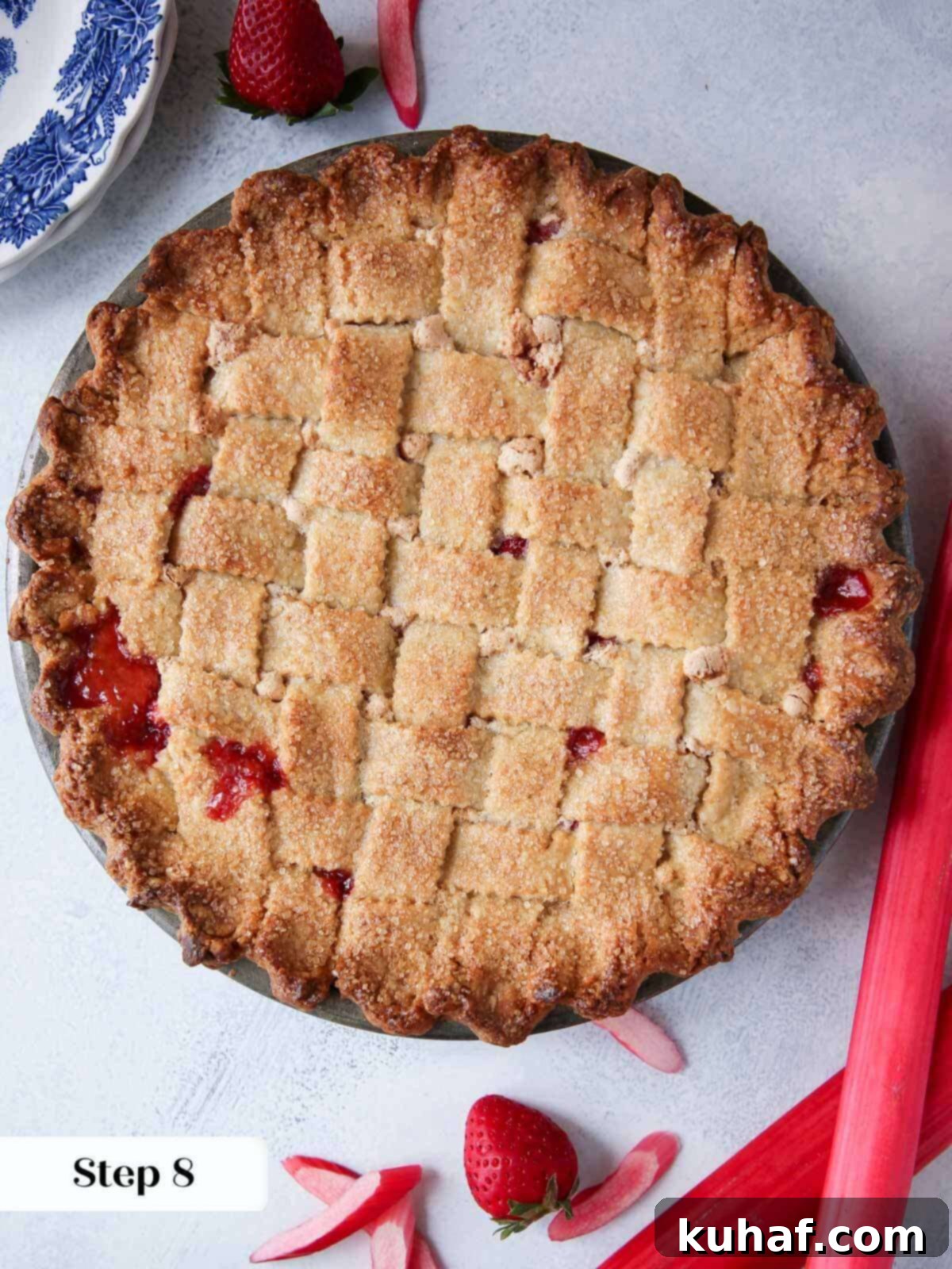 baked strawberry rhubarb pie latticed.