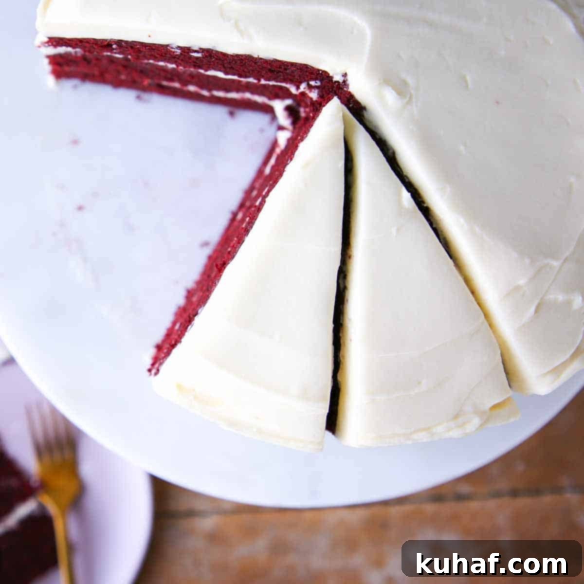 red velvet cake sliced with bourbon cream cheese buttercream marble cake stand.