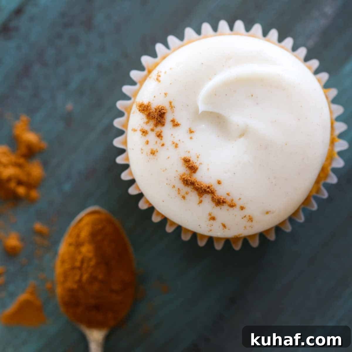 spiced cream cheese buttercream on pumpkin cupcake.