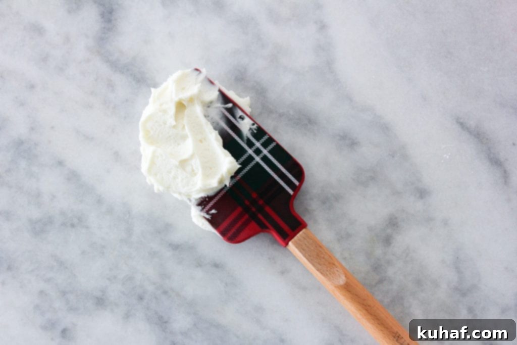 This Peppermint American Buttercream is fast, easy and perfectly peppermint! Spread it on brownies, cookies or cakes for a festive holiday dessert!