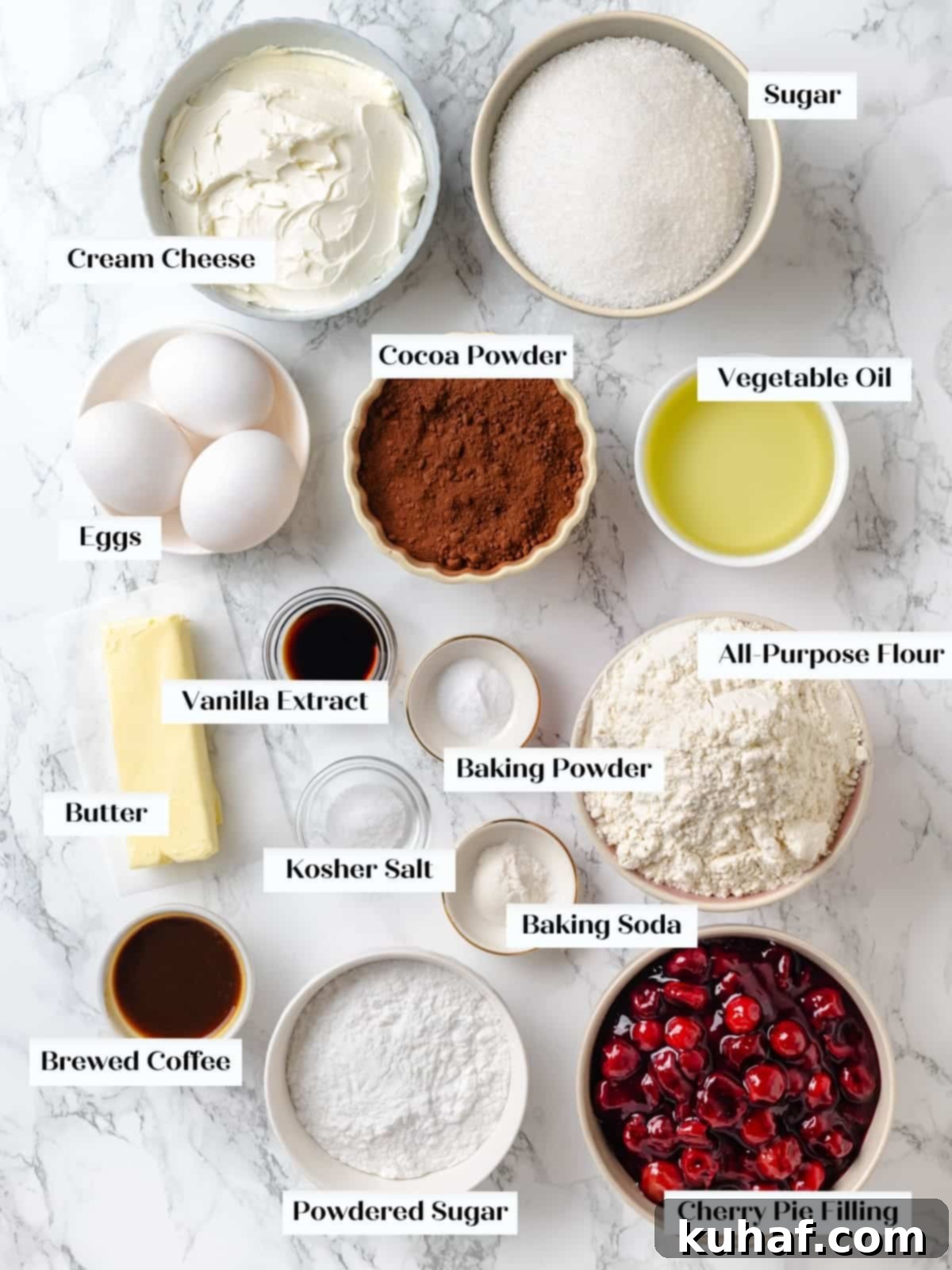 Beautifully arranged chocolate cherry cake ingredients on a kitchen countertop.