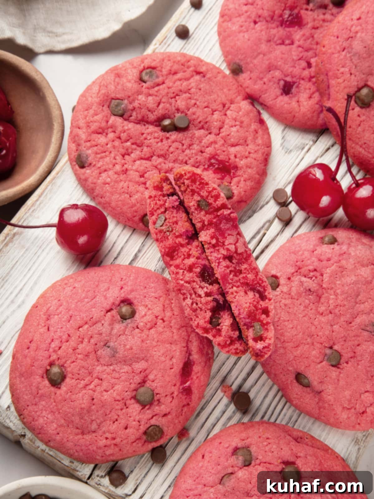 Cherry Chocolate Chunk Cookies 2 Cherry chocolate chip cookie revealing thick center and chocolate chips.