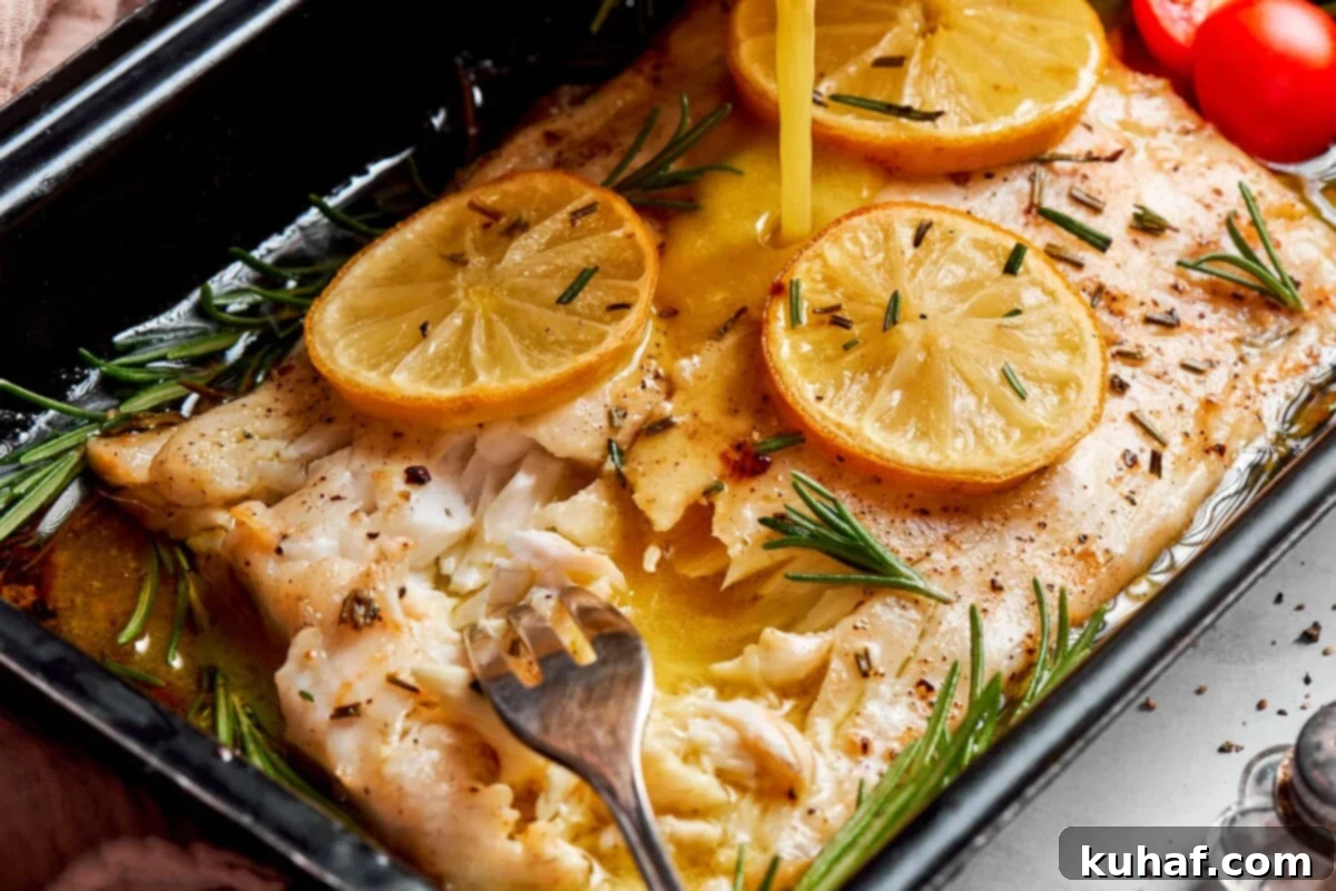 Champagne vinaigrette being poured over baked halibut