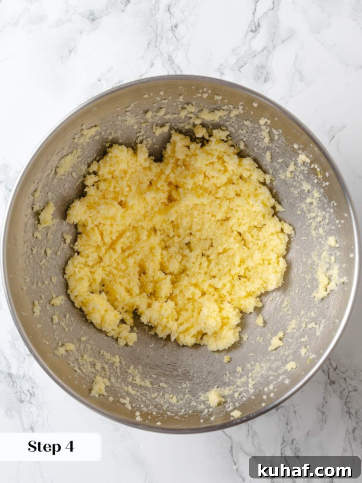 Creaming butter with citrus-infused sugar to build structure for lemon cake.