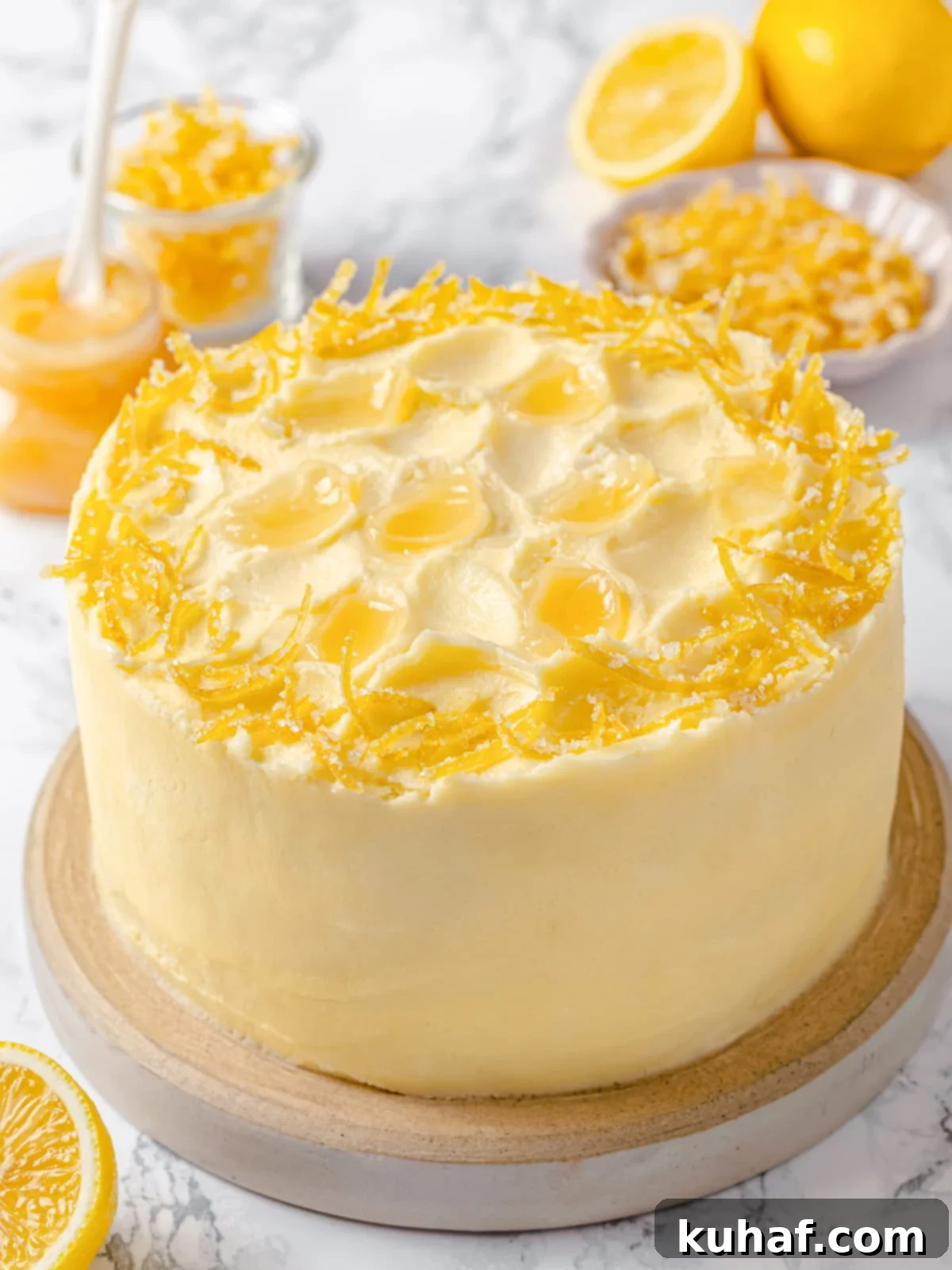 Lemon cake frosted with smooth Lemon Swiss Meringue Buttercream.