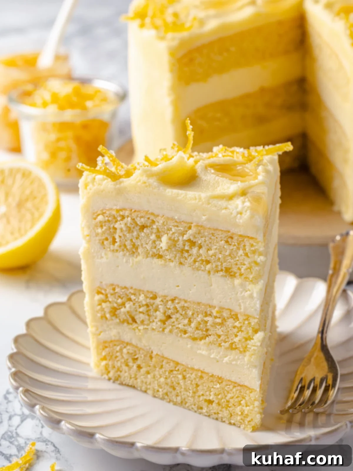 Slice of lemon cake with buttercream layers.