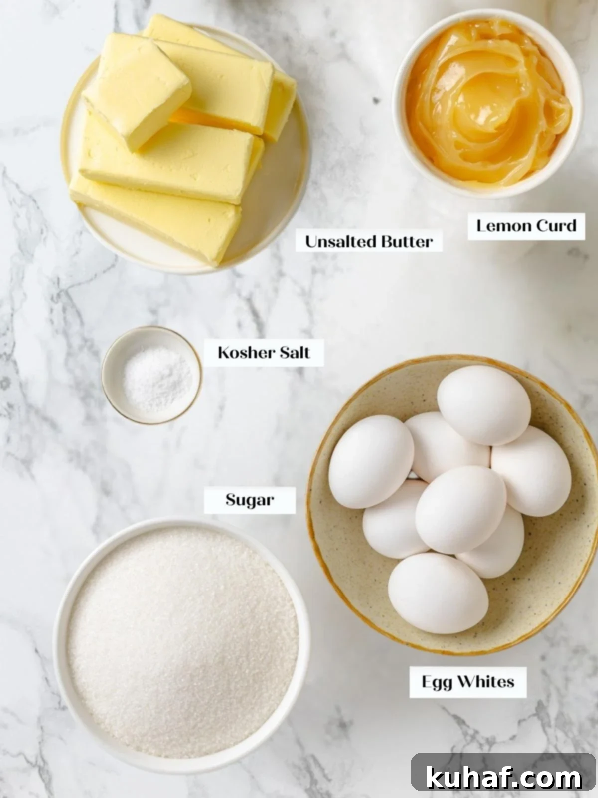 Ingredients for Swiss meringue buttercream including butter, egg whites, sugar, salt, and lemon curd.