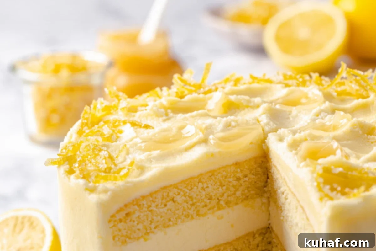 Slice of decorated lemon cake showing buttercream layers inside.