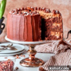 A slice of German chocolate cake being lifted from the cake, showing the layers.