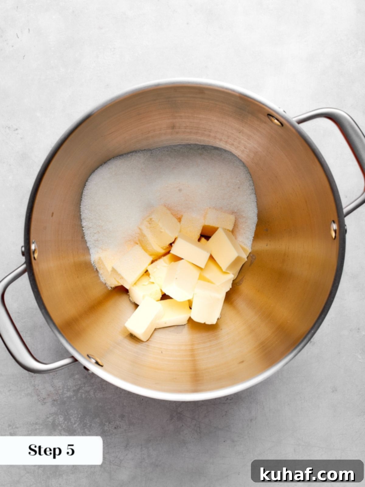 Creaming butter and sugar in a mixer to create a light and airy structure for the chocolate cake batter.